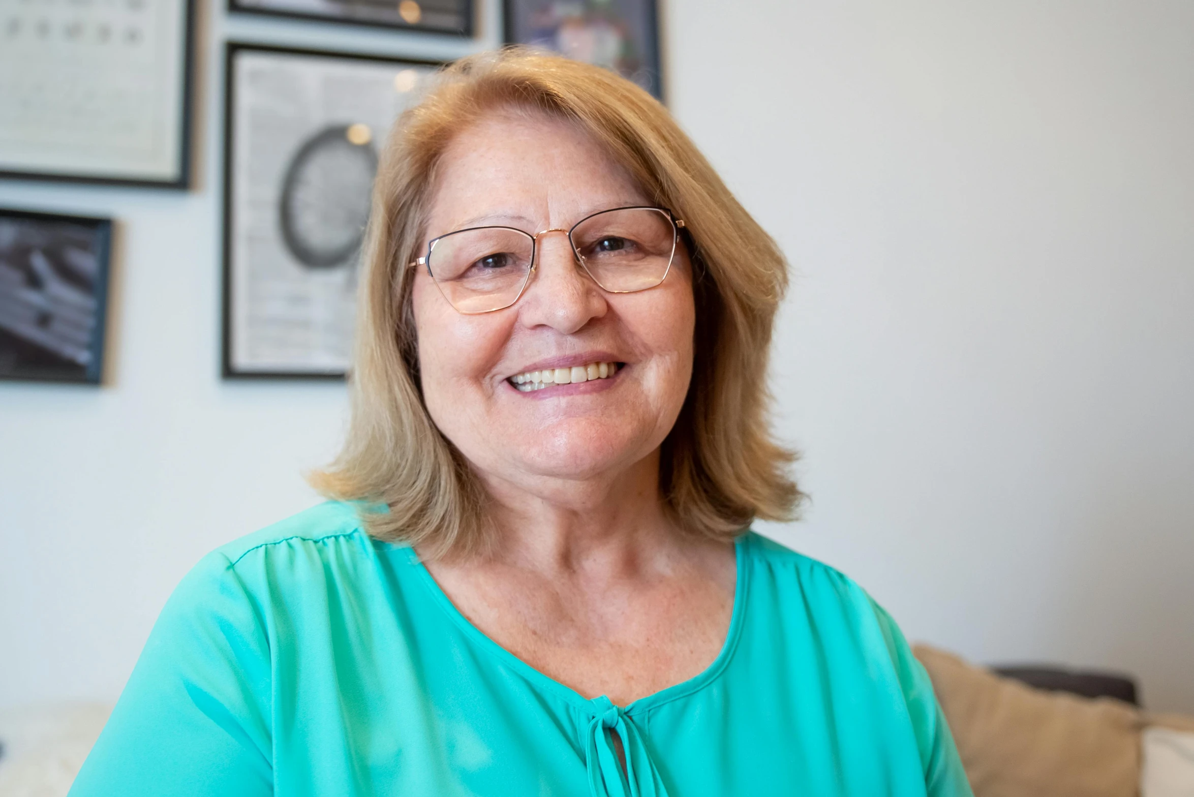 a woman with glasses sitting on a couch, a picture, headshot photograph, lynn skordal, close up portrait photo, profile image