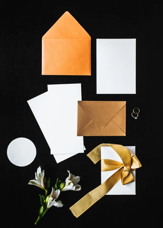 a bunch of different types of paper on a table, white and gold, thumbnail, premium, item