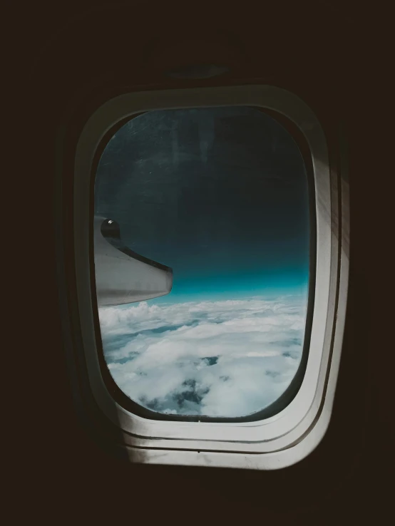 a view of the sky through an airplane window, by Emma Andijewska, pexels contest winner, spaceship window, vintage aesthetic, multiple stories, profile picture 1024px