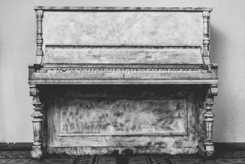 a black and white photo of an old piano, by Jan Kupecký, pexels contest winner, partially covered with dust, carved in white marble, plain background, stippled