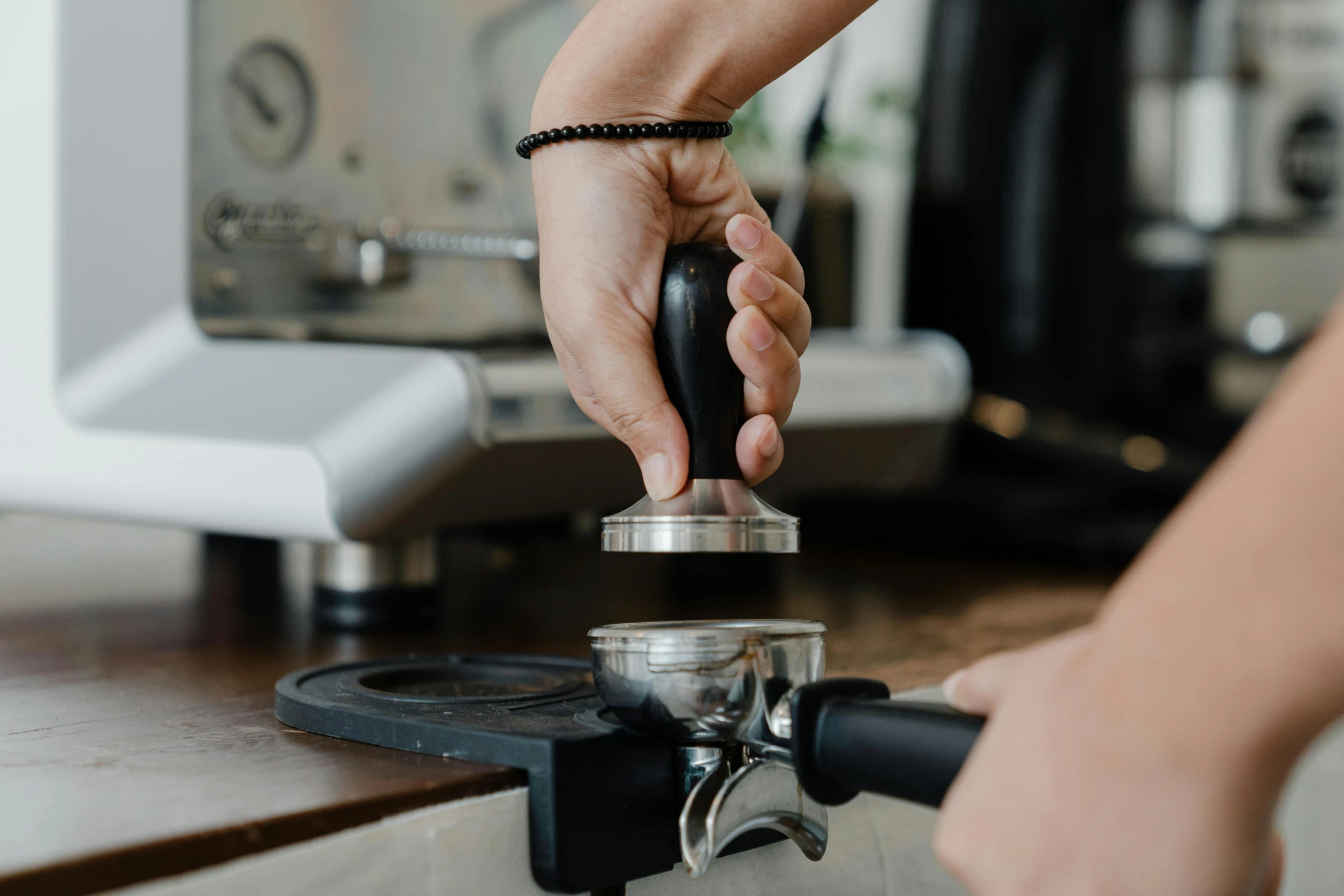 a close up of a person using a coffee machine, profile image