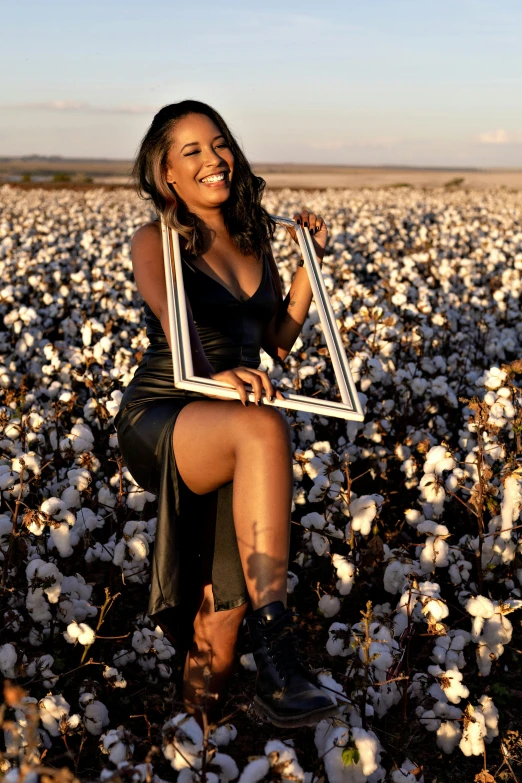 a woman sitting in a cotton field holding a picture frame, black, trending photo, glam photo, 15081959 21121991 01012000 4k