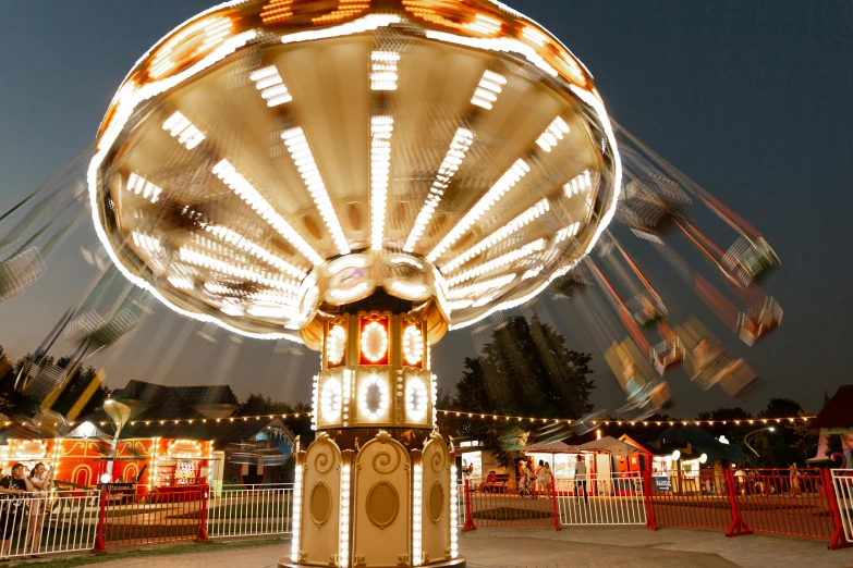 a close up of a carnival ride at night, by Bradley Walker Tomlin, pexels contest winner, photorealism, flying saucer, profile image, panoramic photography, 15081959 21121991 01012000 4k