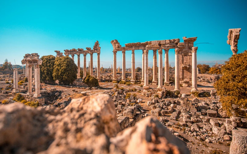 the ruins of the ancient city of volubour in turkey, by Emma Andijewska, pexels contest winner, neoclassicism, square, high quality image, vibrant vivid colors, 1 2 9 7