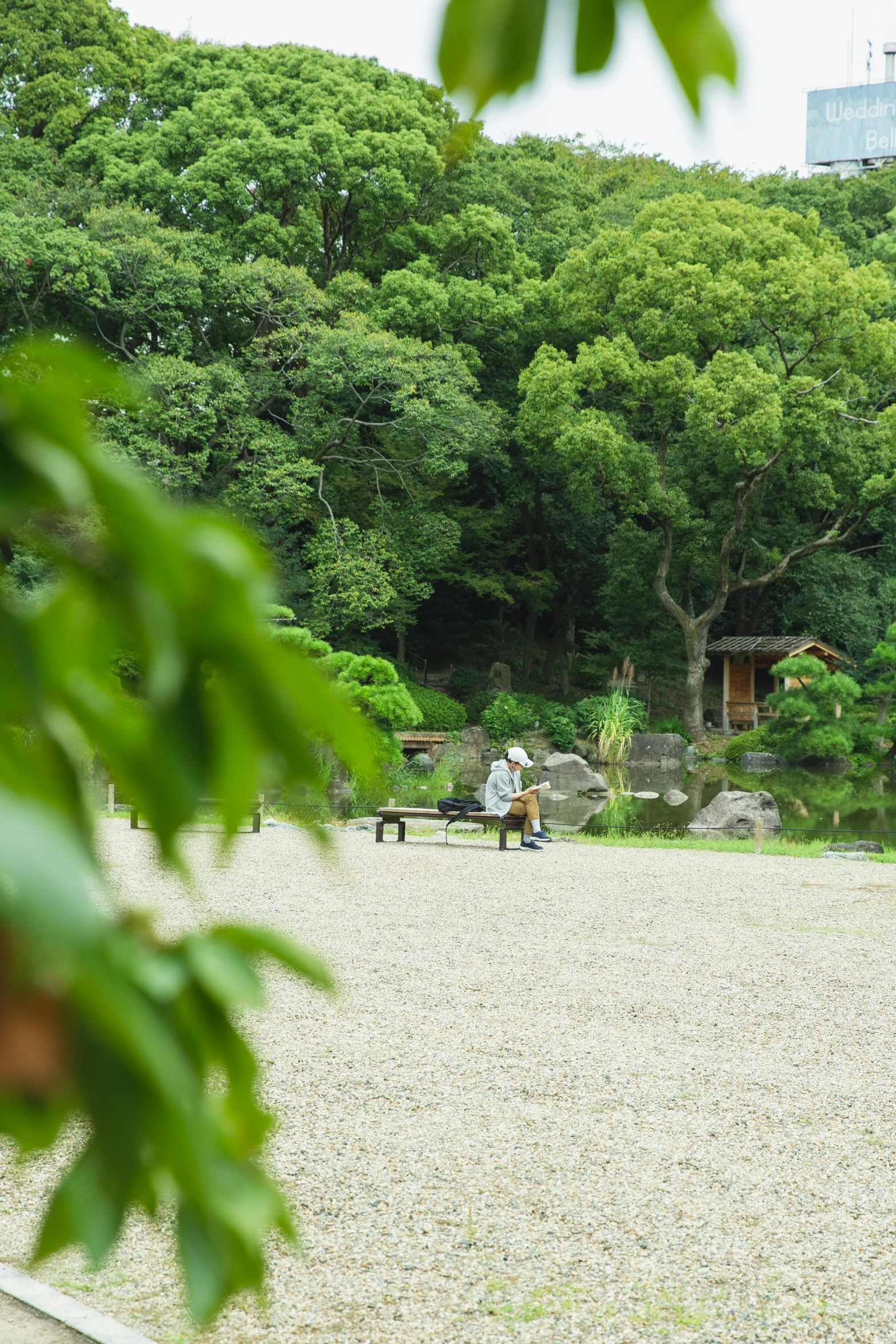 a couple of people that are standing in the dirt, shin hanga, parks and gardens, from a distance, campsites, benches