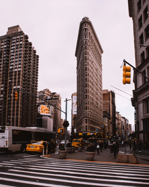 a city street filled with lots of traffic and tall buildings, unsplash contest winner, art nouveau, lgbtq, new york buildings, square, frank lloyd wright