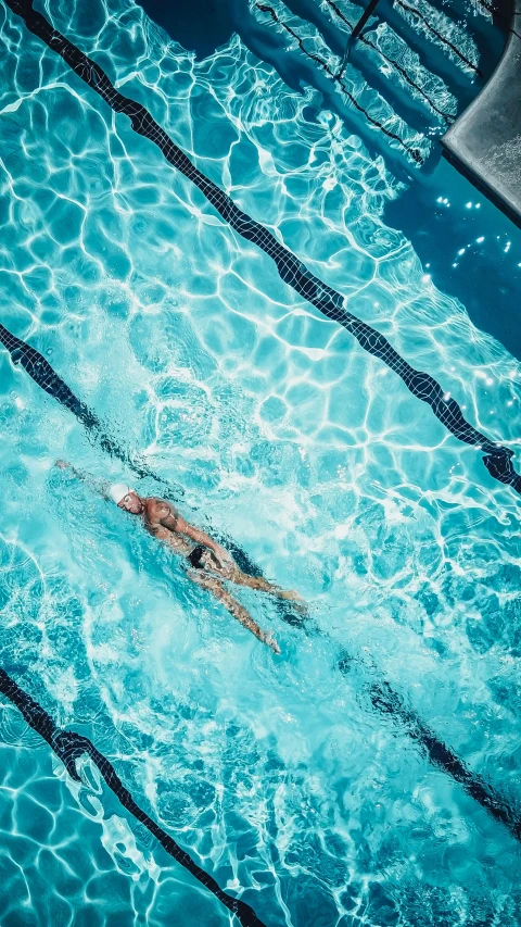 an overhead view of a person swimming in a pool, splento, thumbnail, sport, profile image