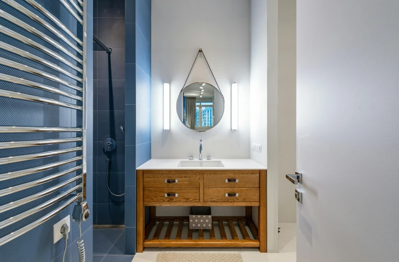 a bath room with a sink a mirror and a towel rack, by Julia Pishtar, unsplash, blue accent lighting, neo kyiv, interior photography, wide - angle view