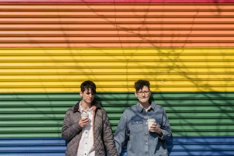 a couple of men standing next to each other, an album cover, by Meredith Dillman, pexels, lgbt, two cups of coffee, cynthwave, exterior shot