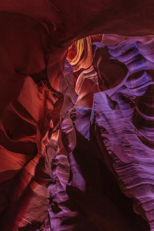 an image of the inside of a canyon, by Greg Rutkowski, red and purple coloring, head shot, color image, lights