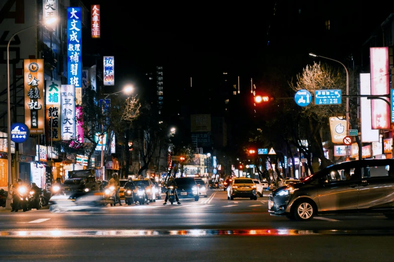 a city street filled with lots of traffic at night, taiwan, fan favorite, square, image