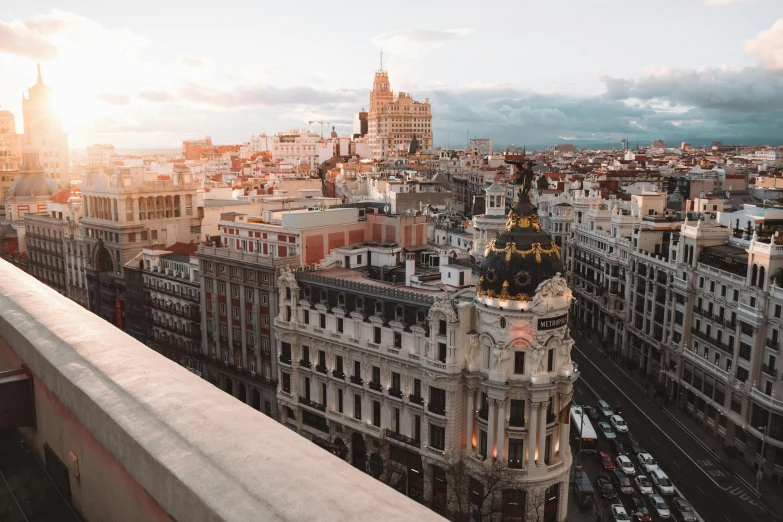 a view of a city from the top of a building, by Luis Molinari, pexels contest winner, art nouveau, madrid, background image, square, high res 8k