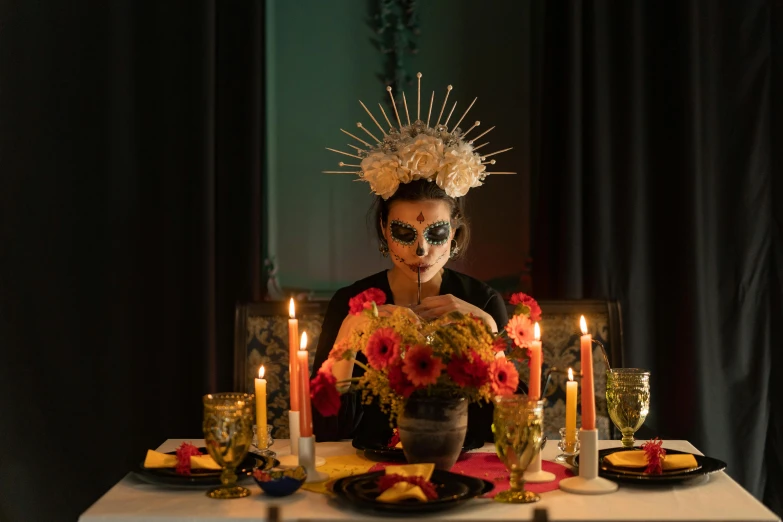 a woman sitting at a table with candles in front of her, inspired by Kahlo, pexels contest winner, vanitas, headpiece, dinner is served, square, high quality photo