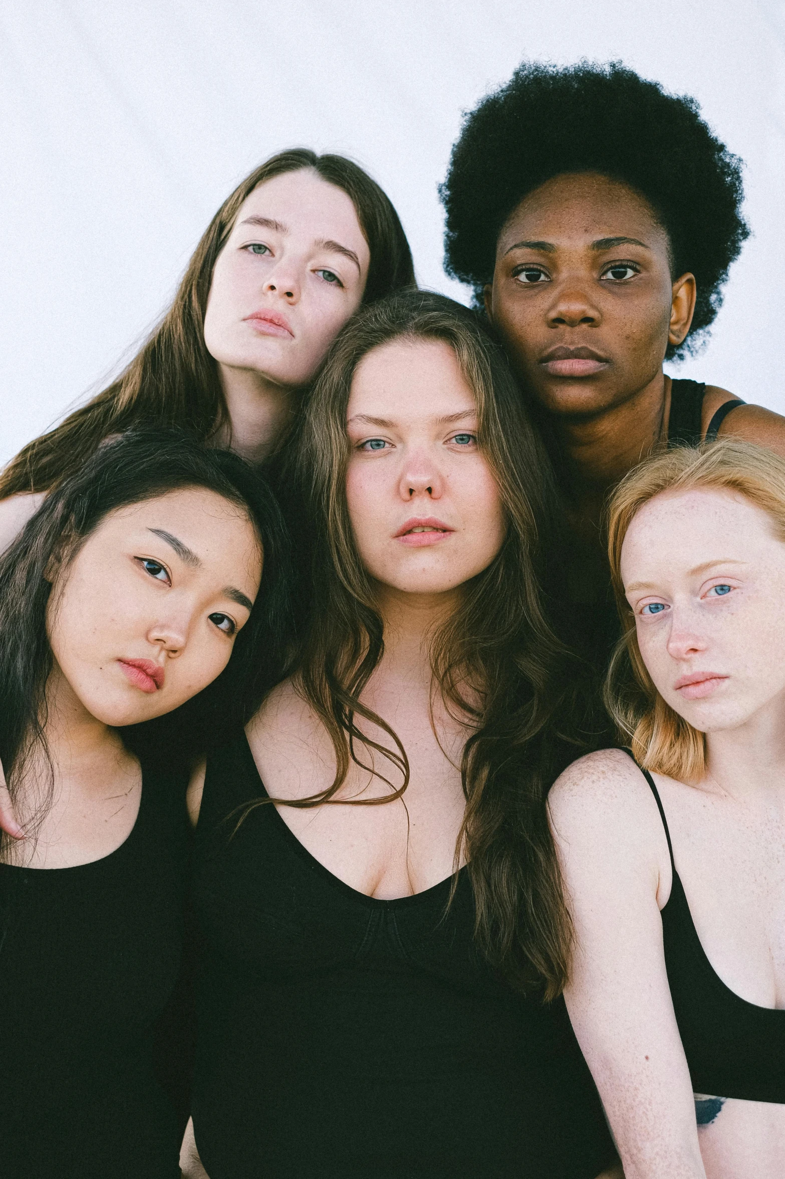 a group of women standing next to each other, inspired by Vanessa Beecroft, unsplash, renaissance, pale round face, teenage girl, black in, soft chin