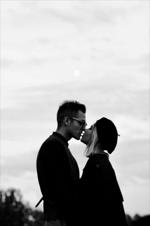 a man and woman standing next to each other, a black and white photo, unsplash, antipodeans, couple kissing, depeche mode, (beautiful) girl, 2995599206