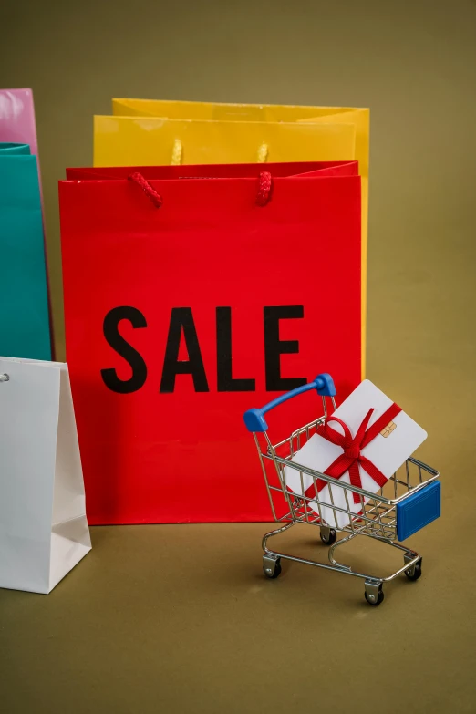 shopping bags and a shopping cart with a sale sign, by Adam Saks, trending on unsplash, thumbnail, holiday, square, mini model
