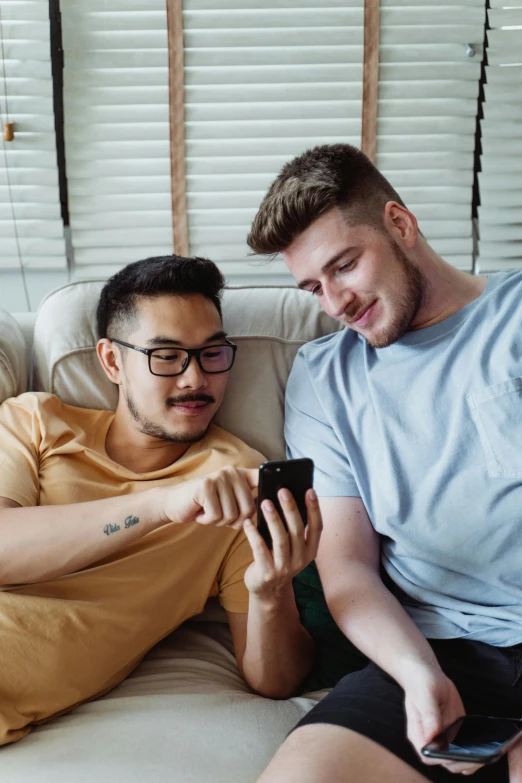 a couple of men sitting on top of a couch, trending on pexels, tinder profile, killian eng, cellphone, wholesome