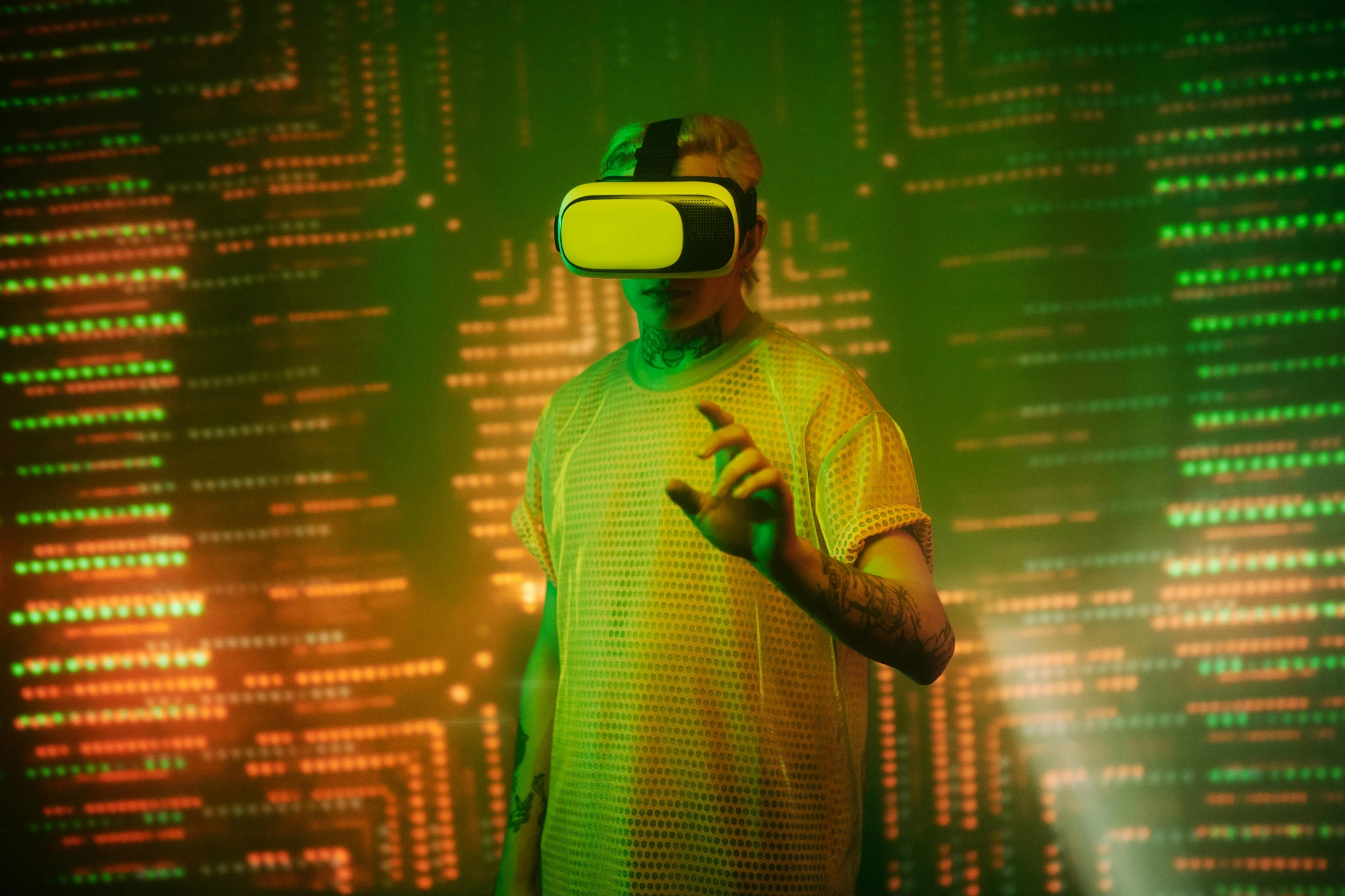 a man in a yellow shirt wearing a virtual reality headset, a hologram, inspired by Mike Winkelmann, pexels, holography, techno neon projector background, a green, pewdiepie, reflection of phone in visor