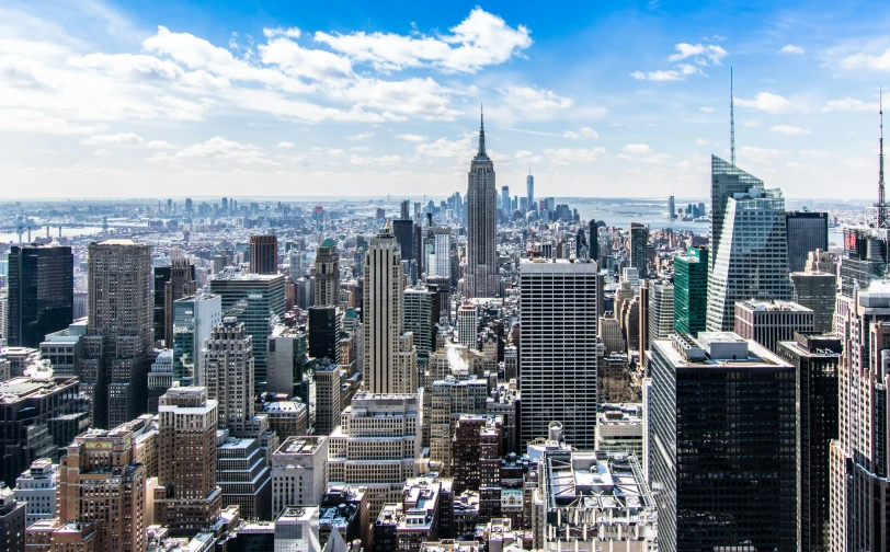 a view of a city from the top of a building, pexels contest winner, modernism, new york skyline, background image, beautiful day