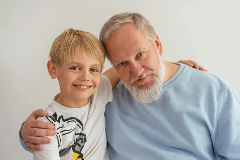 an older man and a young boy posing for a picture, pexels contest winner, portrait of hide the pain harold, blond boy, high rendering, local conspirologist