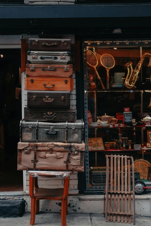 a store front filled with lots of different types of luggage, an album cover, trending on pexels, assemblage, antique, 🚿🗝📝