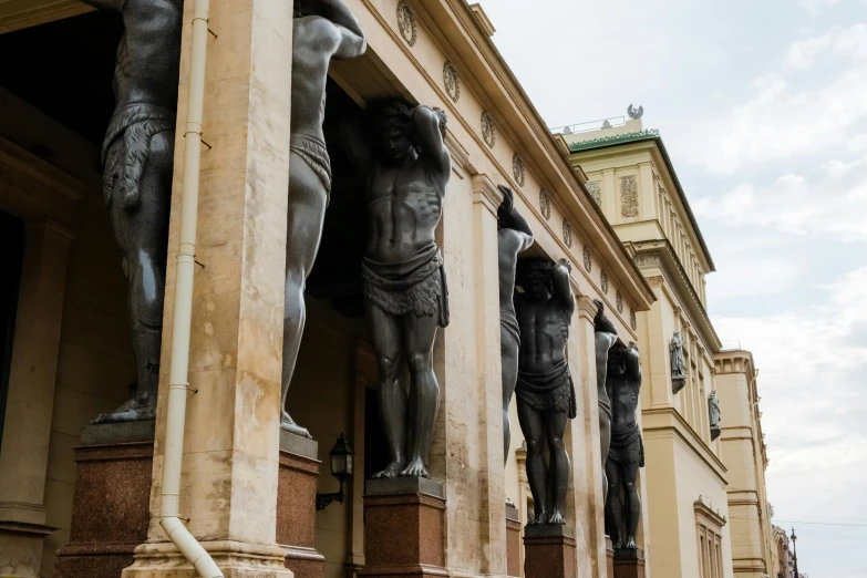 a group of statues that are on the side of a building, a statue, inspired by Károly Markó the Elder, neoclassicism, archways between stalagtites, the fall of man, museum background, thumbnail