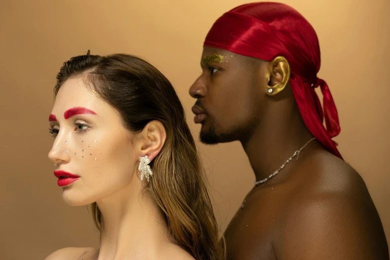 a man and a woman standing next to each other, trending on pexels, renaissance, pat mcgrath, red headband, pearl earring, diverse