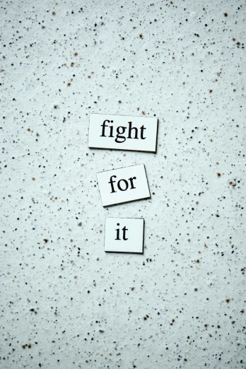 there is a sign that says fight for it, on a pale background, unsplash contest winning photo, magnetic, 3 - piece
