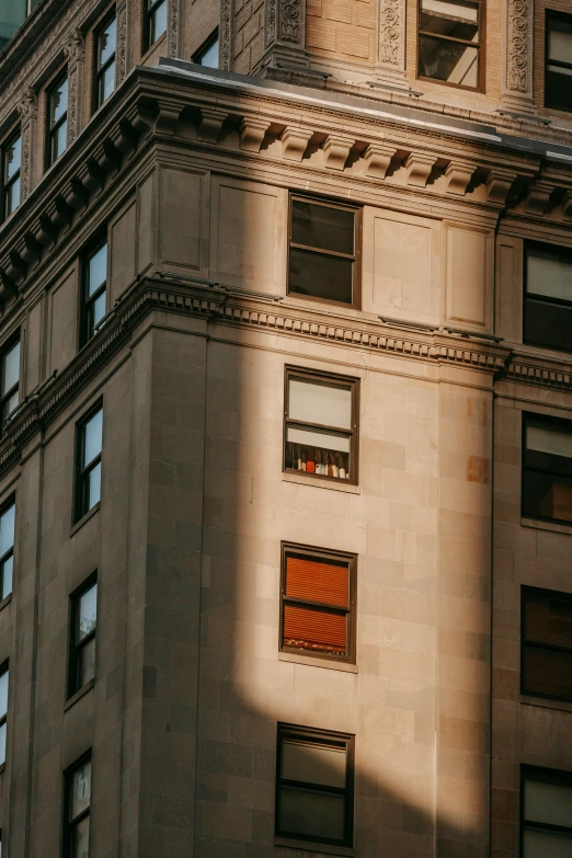 a clock that is on the side of a building, inspired by Edward Hopper, unsplash contest winner, warm light, cramped new york apartment, buildings carved out of stone, exterior view