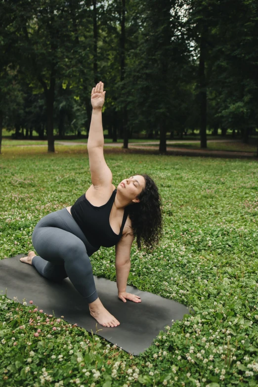 a woman doing a yoga pose in a park, pexels contest winner, renaissance, curvy build, promo image, full frame image, caucasian