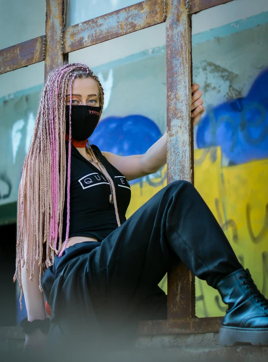 a woman with pink hair wearing a face mask, inspired by Elsa Bleda, trending on pexels, graffiti, wearing a cropped black tank top, attractive androgynous humanoid, cybernetic dreadlocks, 2019 trending photo