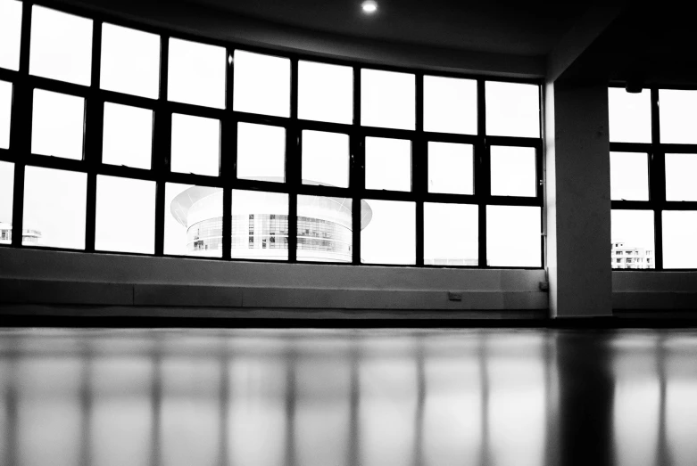 a black and white photo of a large window, by Jan Rustem, shiny floors, circular, studio medium format photograph, taken with my nikon d 3