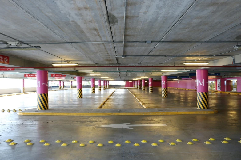 a parking garage filled with lots of parking space, a portrait, unsplash, pink, square, te pae, concrete hitech interior