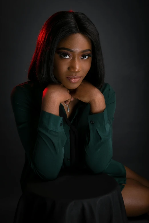 a woman sitting on top of a black table, beautiful portrait lighting, ( ( dark skin ) ), promo image, dark. no text