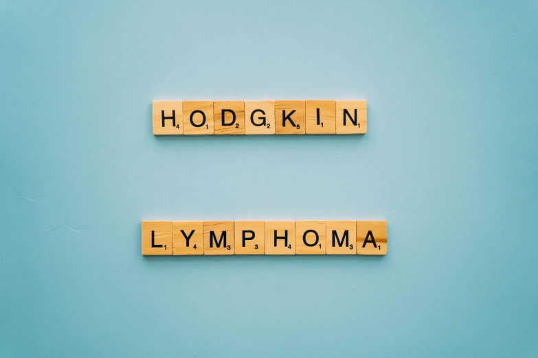 wooden scrabbles spelling hogkin lymphma on a blue background, an album cover, inspired by Eliot Hodgkin, shutterstock, high resolution print :1 cmyk :1, taken from the high street, himalayan rocksalt lamp, thought-provoking
