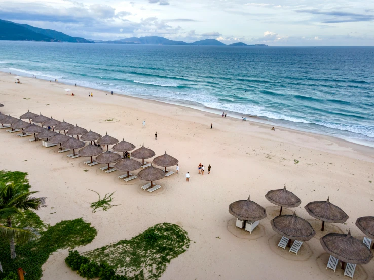 a beach filled with lots of umbrellas next to the ocean, in style of lam manh, profile image, holiday resort, thumbnail