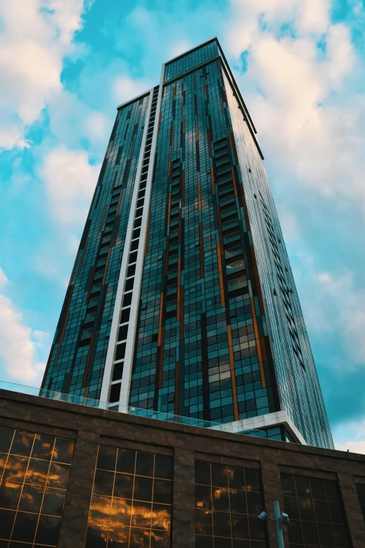 a tall building with a blue sky in the background, thumbnail, neo kyiv, manchester, 2 0 7 7