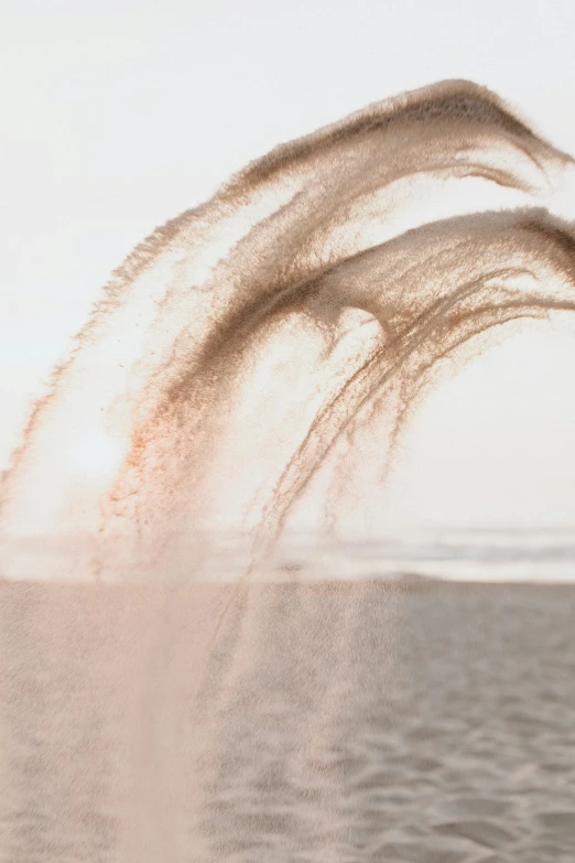 a man flying through the air while riding a jet ski, by Jan Tengnagel, trending on unsplash, conceptual art, sand color, morning detail, water particulate, mane