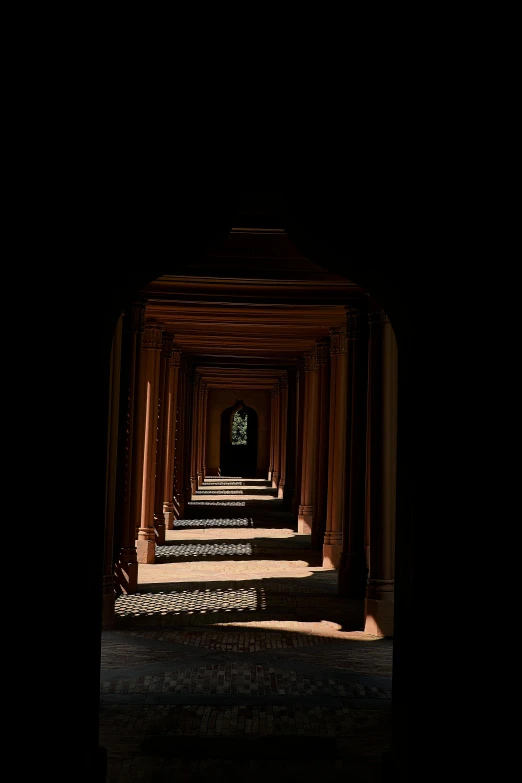 a dark hallway with a light at the end, inspired by Ricardo Bofill, unsplash contest winner, intricate carved wood, angkor wat, midday sunlight, shot on sony alpha dslr-a300