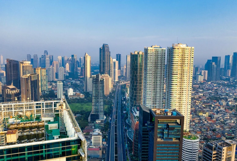 a view of a city from the top of a building, by Bernardino Mei, pexels contest winner, hyperrealism, indonesia, background image, skyscrapers in the distance, slide show