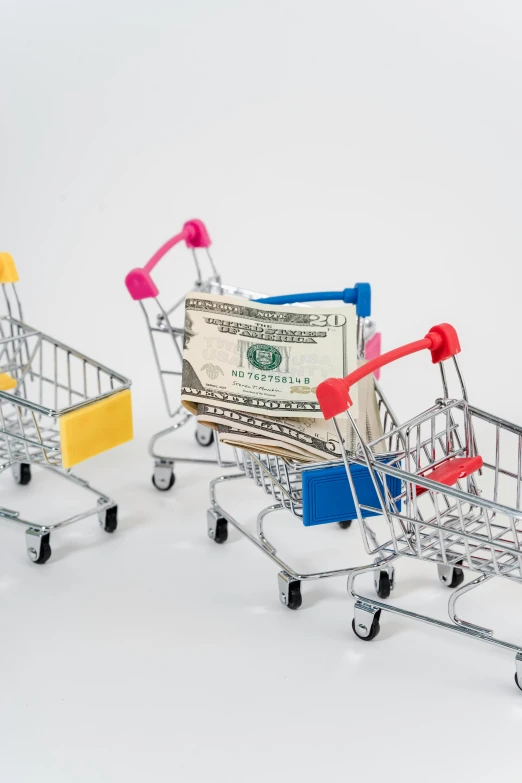 three shopping carts filled with money sitting next to each other, product image, model kit, promo image, 6
