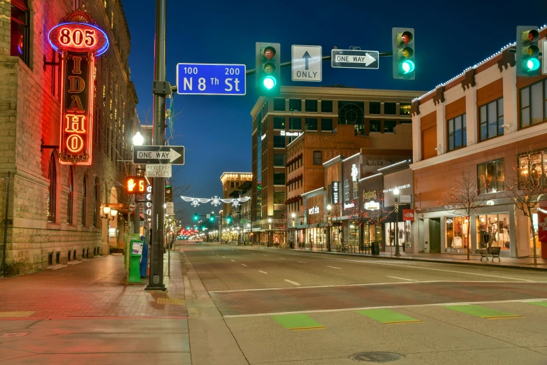 a city street filled with lots of traffic lights, a digital rendering, by Greg Spalenka, unsplash, kansas town at midnight, square, walton's five and dime, pristine and clean