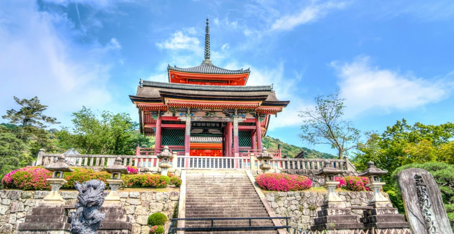 a pagoda sitting on top of a lush green hillside, inspired by Torii Kiyomitsu, pexels contest winner, ukiyo-e, pink marble building, exterior, brightly coloured, japanese flower arrangements