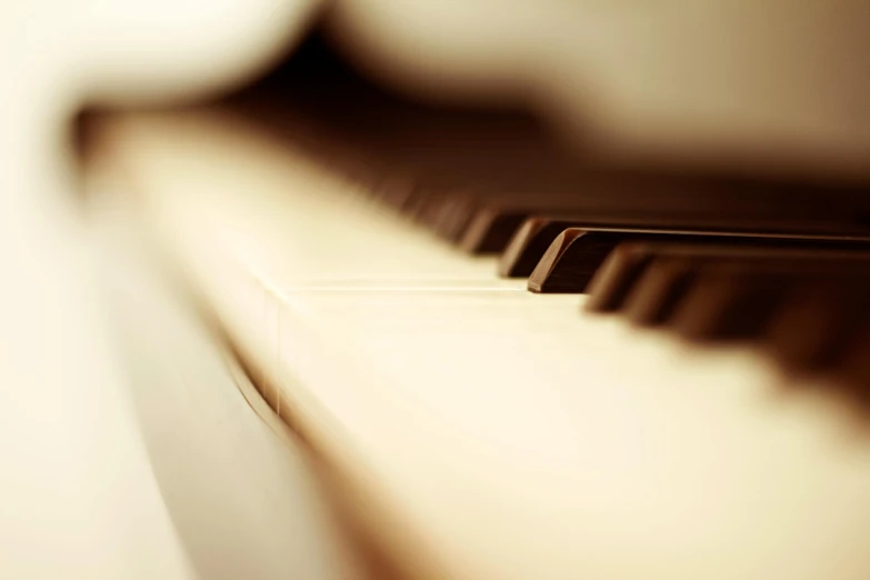 a close up of the keys of a piano, an album cover, by David Simpson, unsplash, romanticism, soft sepia tones, soft light - n 9, computer wallpaper, warm coloured
