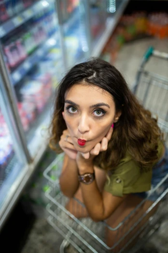 a woman sitting in a shopping cart looking at the camera, pexels contest winner, renaissance, cute pout, inside a supermarket, chalk, angela sarafyan
