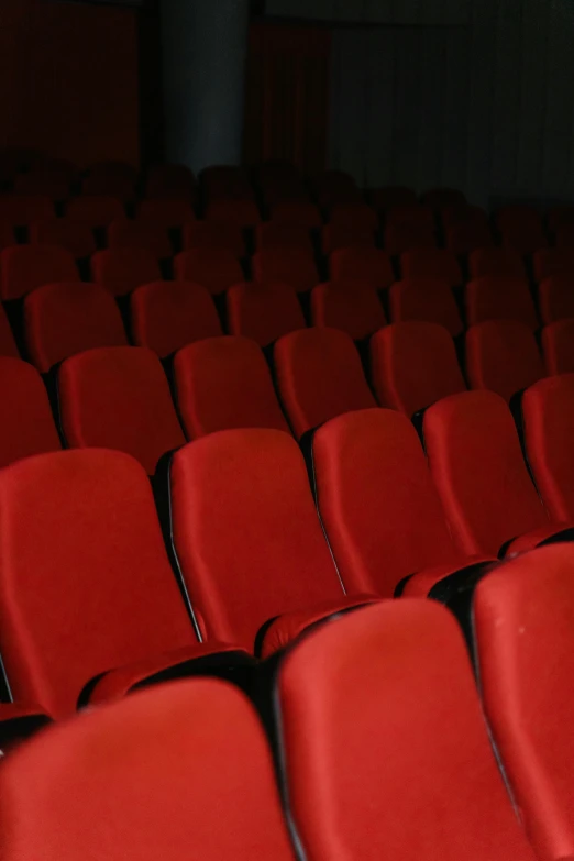 a bunch of red chairs sitting next to each other, profile image, theater, multiple stories, indoor picture