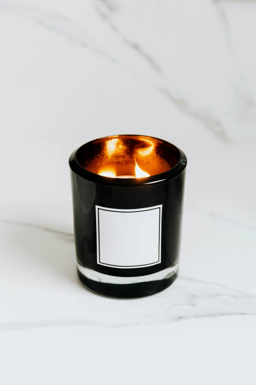 a close up of a candle on a table, by Robbie Trevino, or black, product, glossy, premium