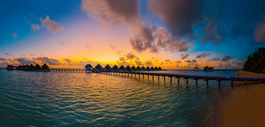 a pier in the middle of a body of water, pexels contest winner, huts, gorgeous romantic sunset, avatar image, exotic endless horizon