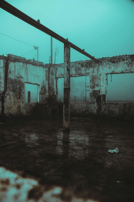 an abandoned building with a blue sky in the background, inspired by Elsa Bleda, unsplash contest winner, conceptual art, dark foggy water, wet floor, destroyed human structures, at evening during rain