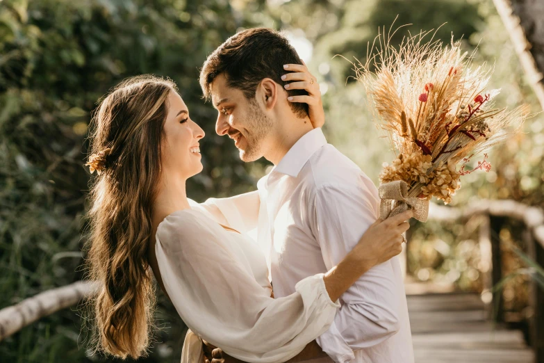 a man standing next to a woman holding a bunch of flowers, pexels contest winner, profile image, 🍁 cute, embrace, background image